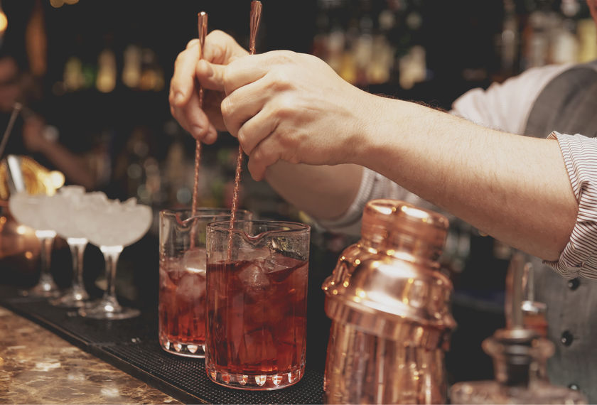 Bartender is stirring cocktails